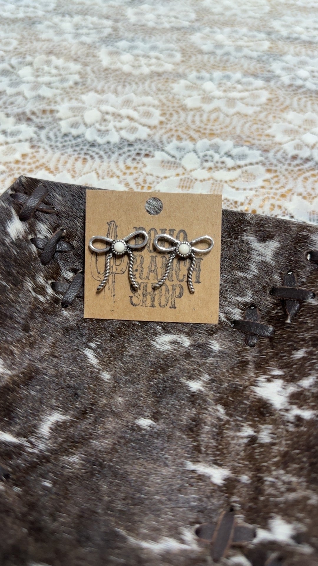 White bow earrings