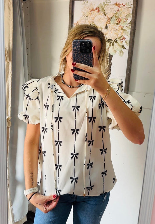 White bow printed ruffle top