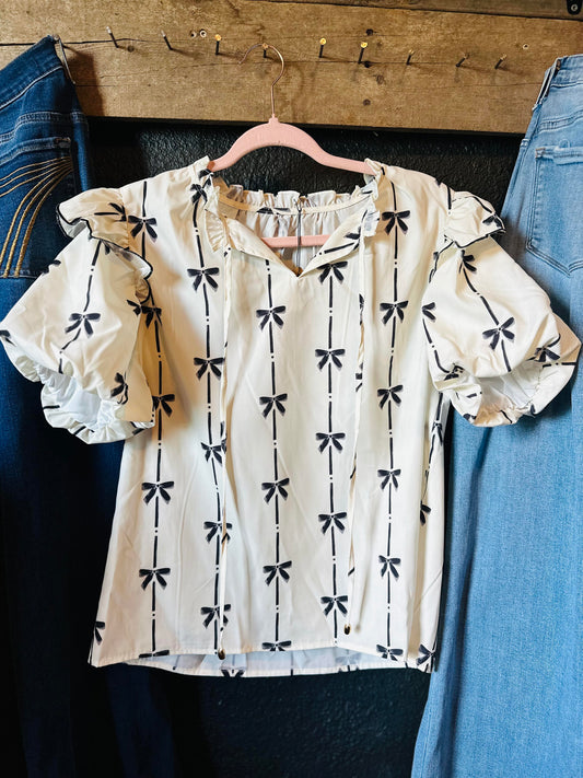 White bow printed ruffle top